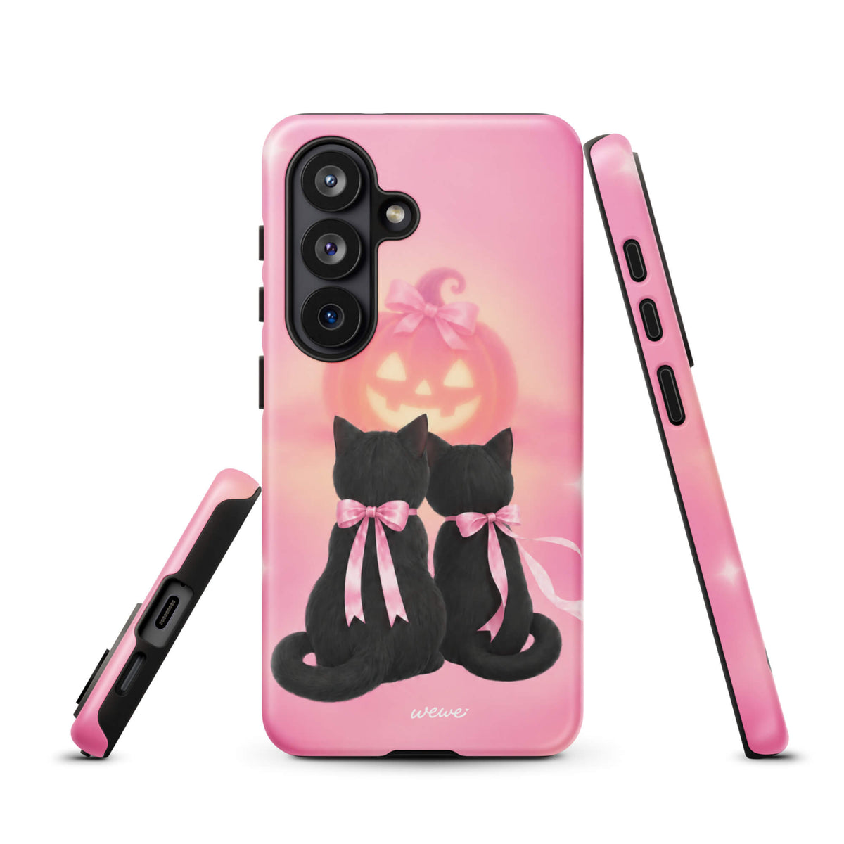 Bubblegum-pink iPhone case with two black cats wearing pink bows and a glowing jack-o-lantern
