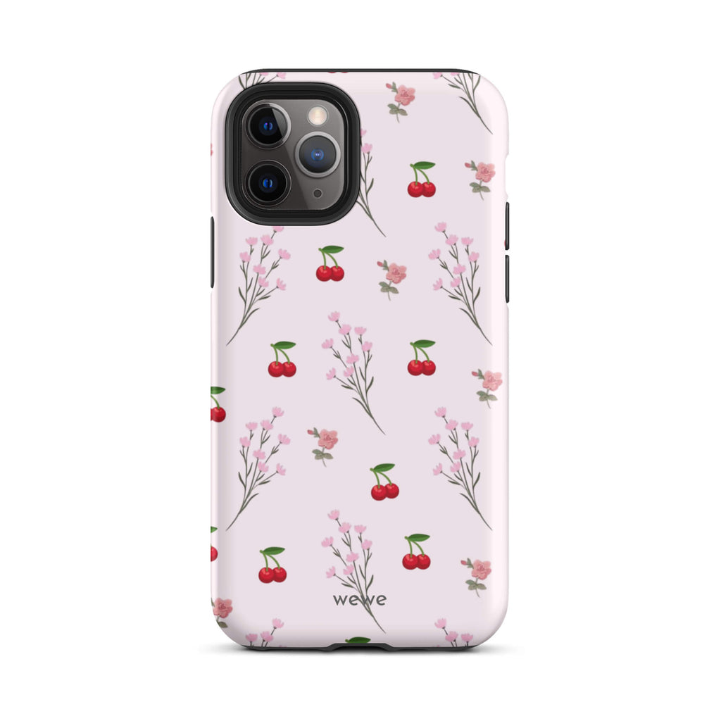 Custom iPhone case 11 pro with a cute and whimsical pattern of cherry branches, blossoms, and ripe cherries on a pale pink background.