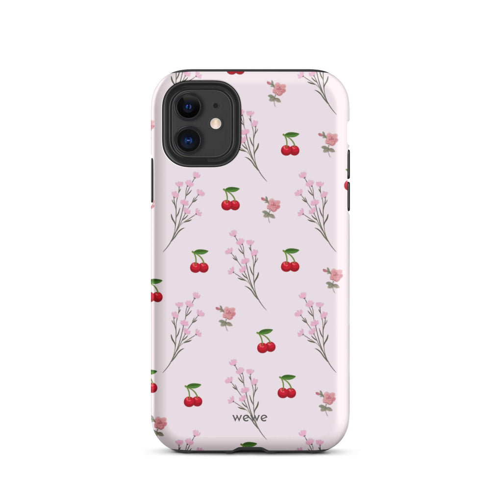 Custom iPhone case 11 with a cute and whimsical pattern of cherry branches, blossoms, and ripe cherries on a pale pink background.