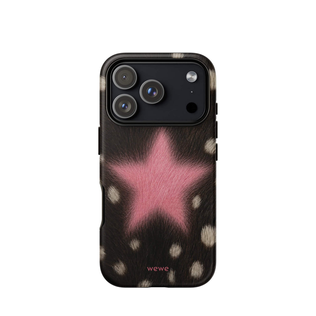Dark brown, black and cream cow-print iPhone case with a large soft-focus bubblegum-pink fuzzy star