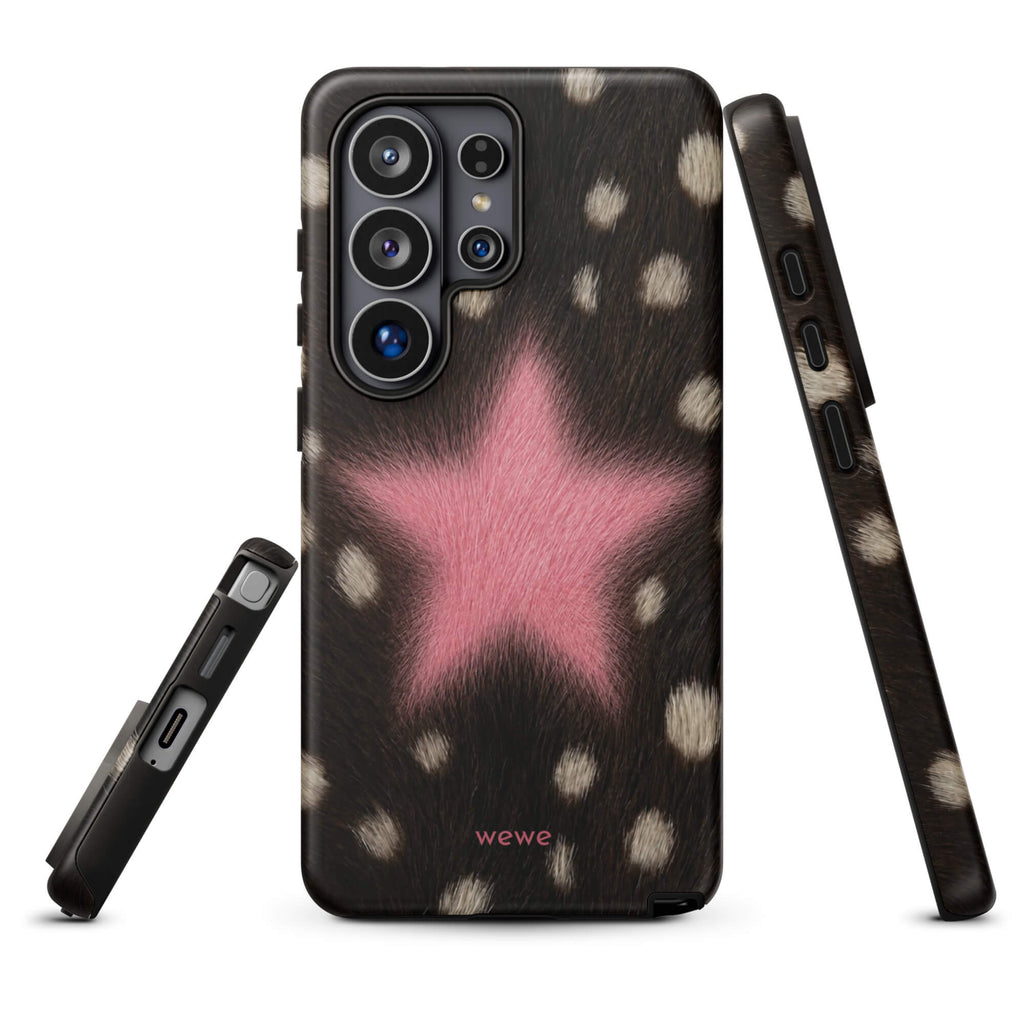 Dark brown, black and cream cow-print iPhone case with a large soft-focus bubblegum-pink fuzzy star