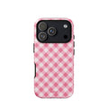 Bubblegum-pink and soft-white iPhone case with an evenly repeated gingham check pattern