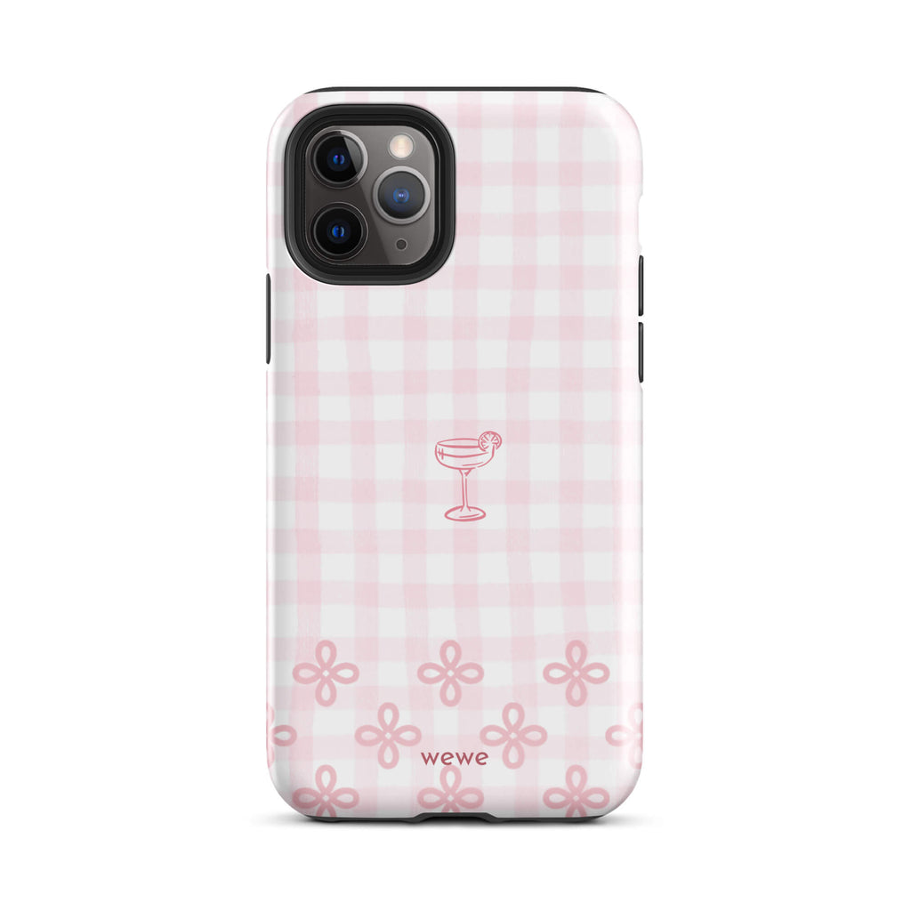 Custom iPhone case 11 pro with pink and white gingham checkered pattern, cocktail glass illustration, and ribbon designs.