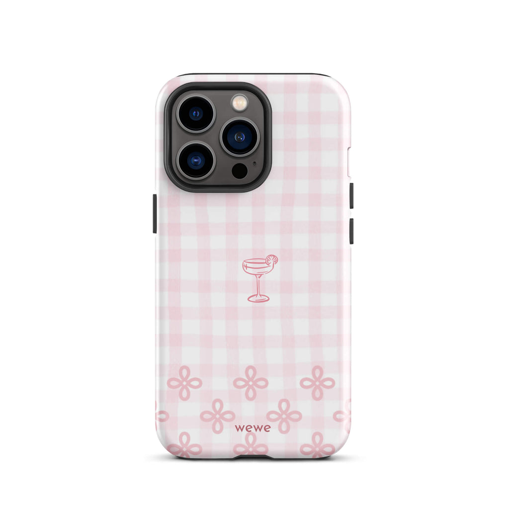 Custom iPhone case 13 pro with pink and white gingham checkered pattern, cocktail glass illustration, and ribbon designs.