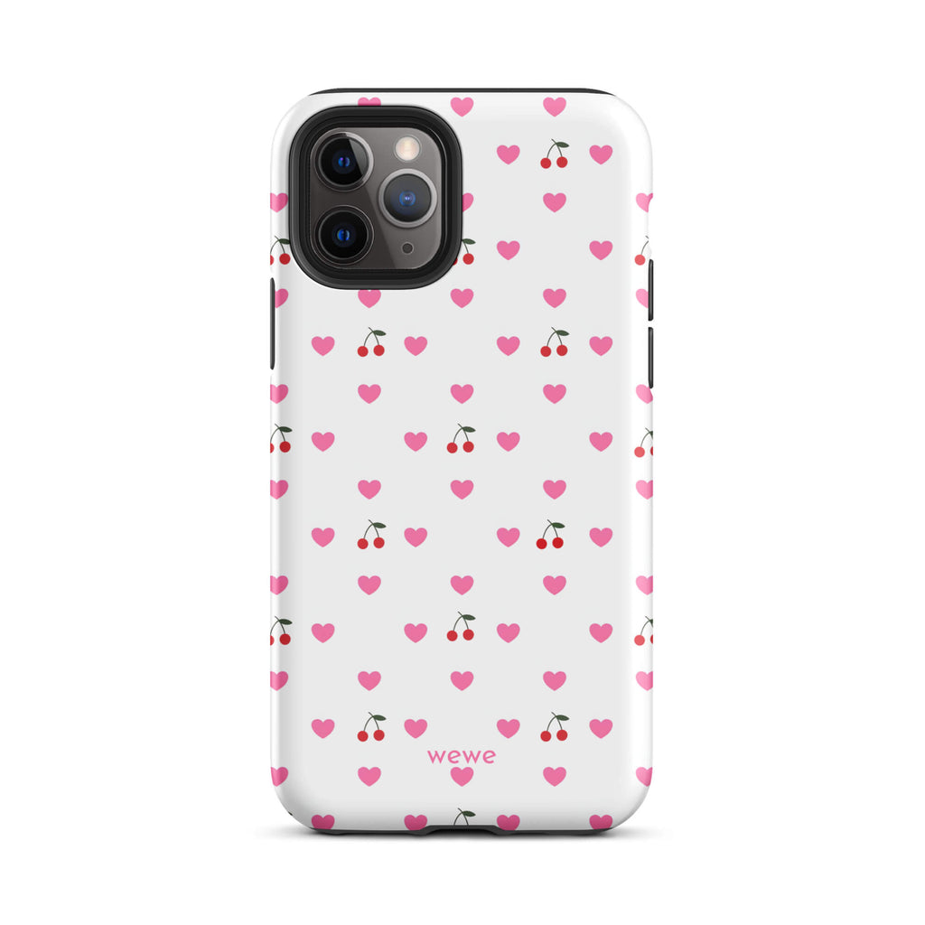 Custom iPhone case 11 pro with a seamless texture pattern of small pink hearts and red cherries on a white background.