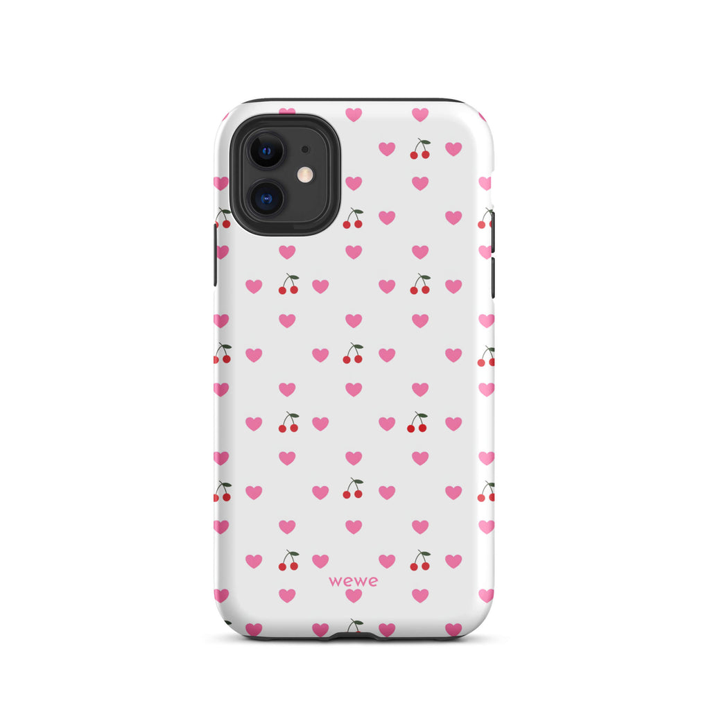 Custom iPhone case 11 with a seamless texture pattern of small pink hearts and red cherries on a white background.