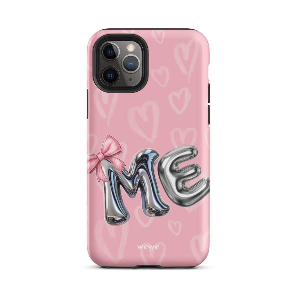 Custom iPhone case 11 pro with pink background,pink bow,and silver chrome 'ME' balloon letters.