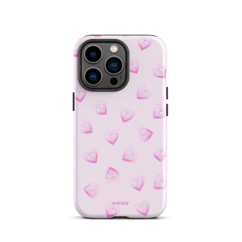 Pink Mini Heart Phone Case featuring scattered small gradient-pink hearts and layered outlines on a pale blush background