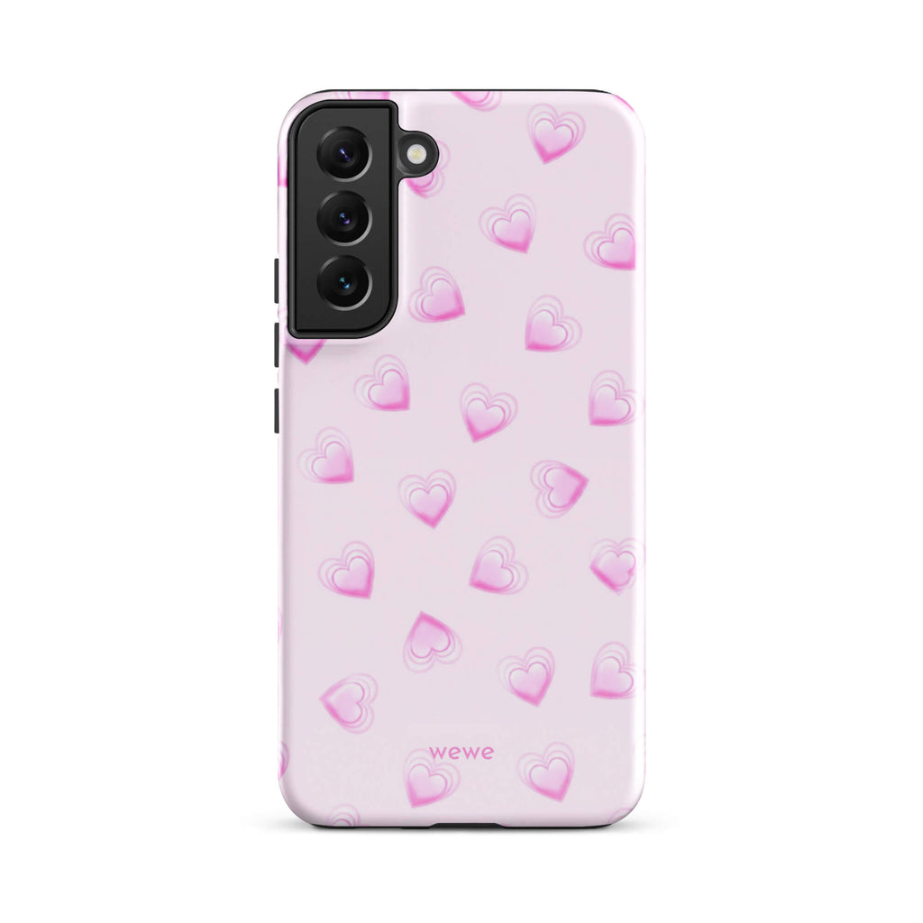 Pink Mini Heart Phone Case featuring scattered small gradient-pink hearts and layered outlines on a pale blush background