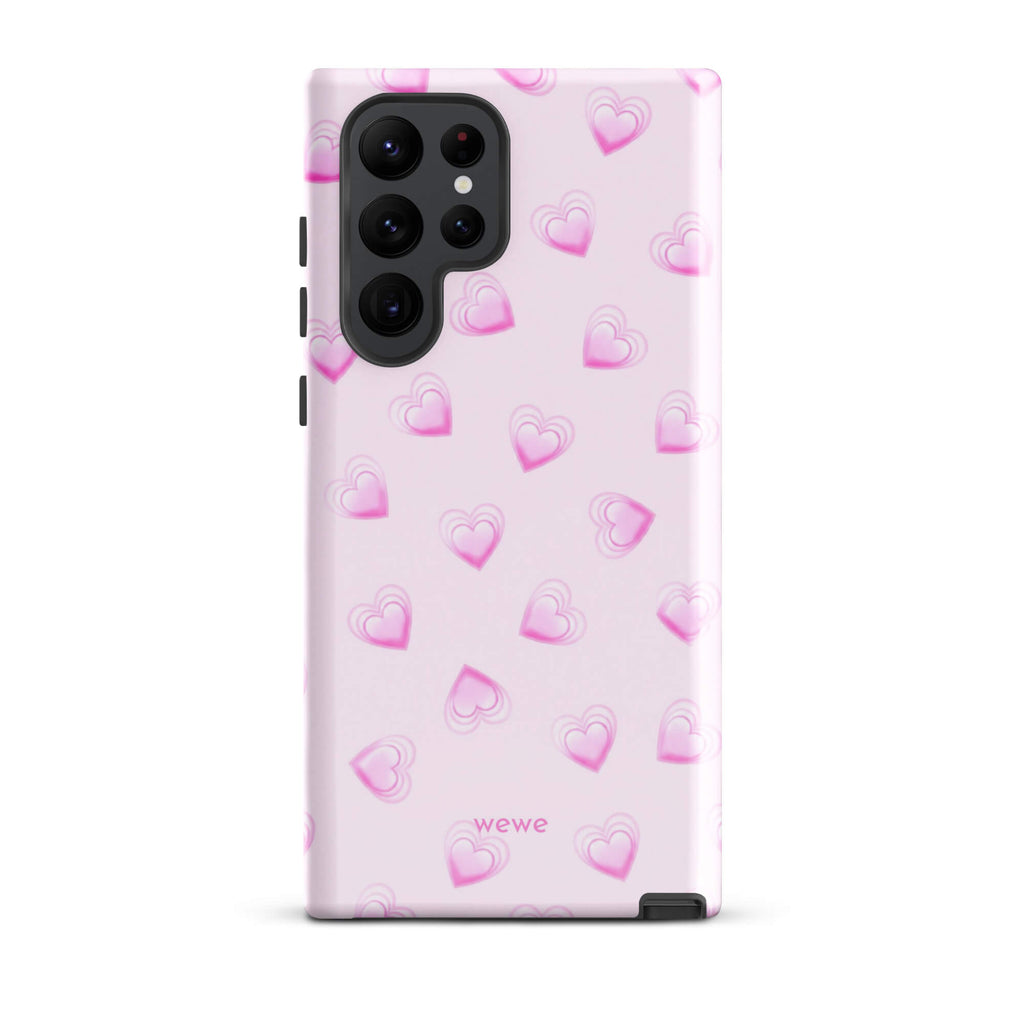 Pink Mini Heart Phone Case featuring scattered small gradient-pink hearts and layered outlines on a pale blush background