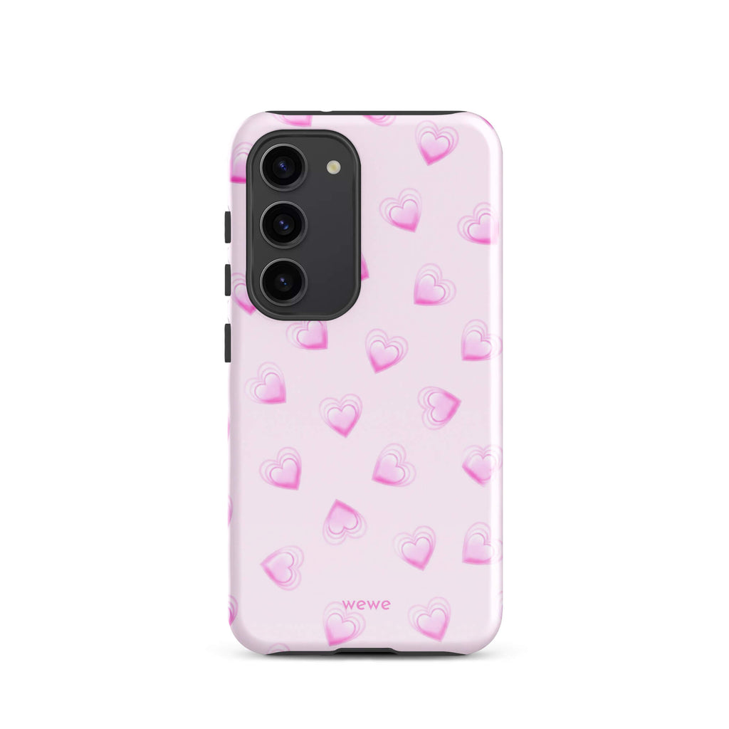 Pink Mini Heart Phone Case featuring scattered small gradient-pink hearts and layered outlines on a pale blush background