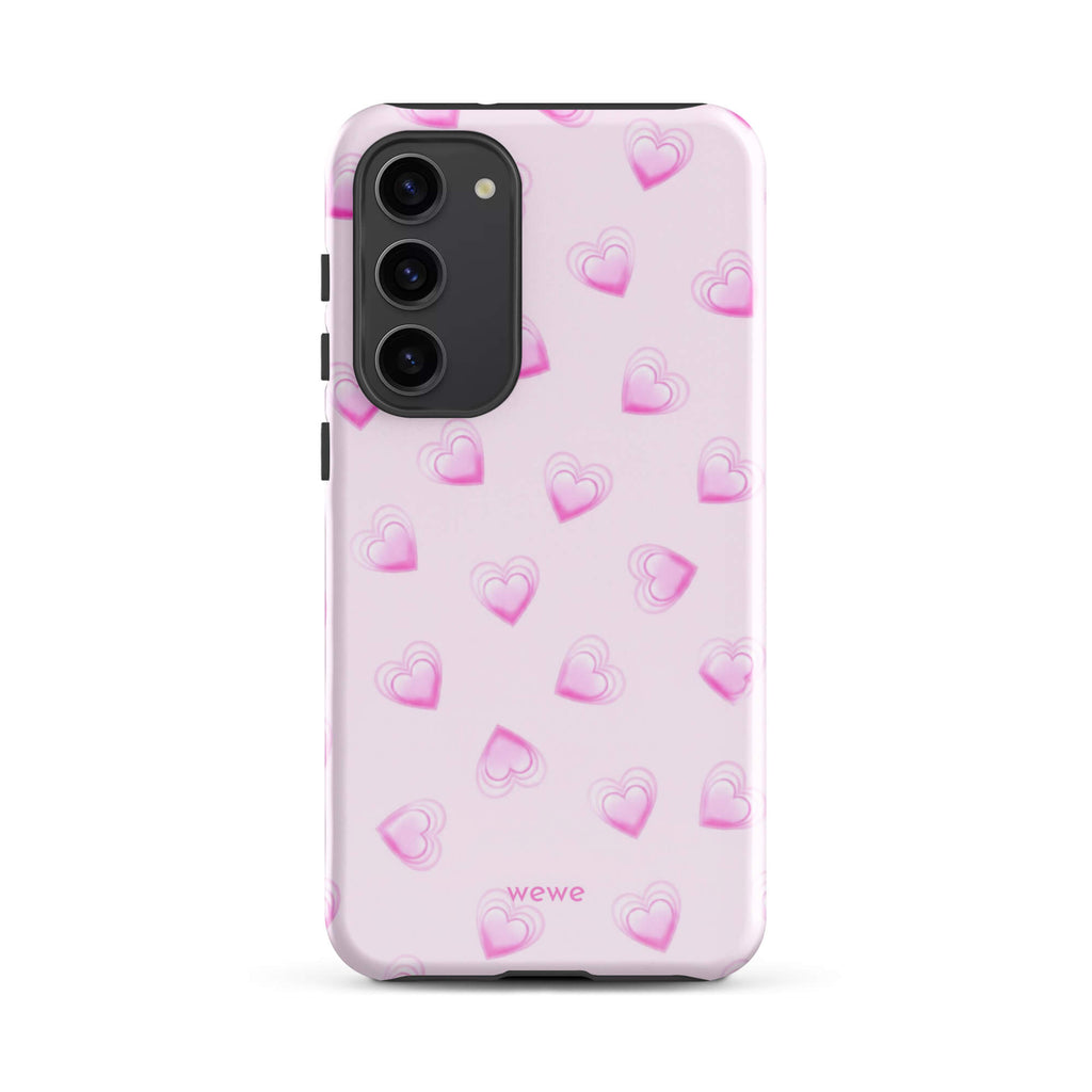 Pink Mini Heart Phone Case featuring scattered small gradient-pink hearts and layered outlines on a pale blush background