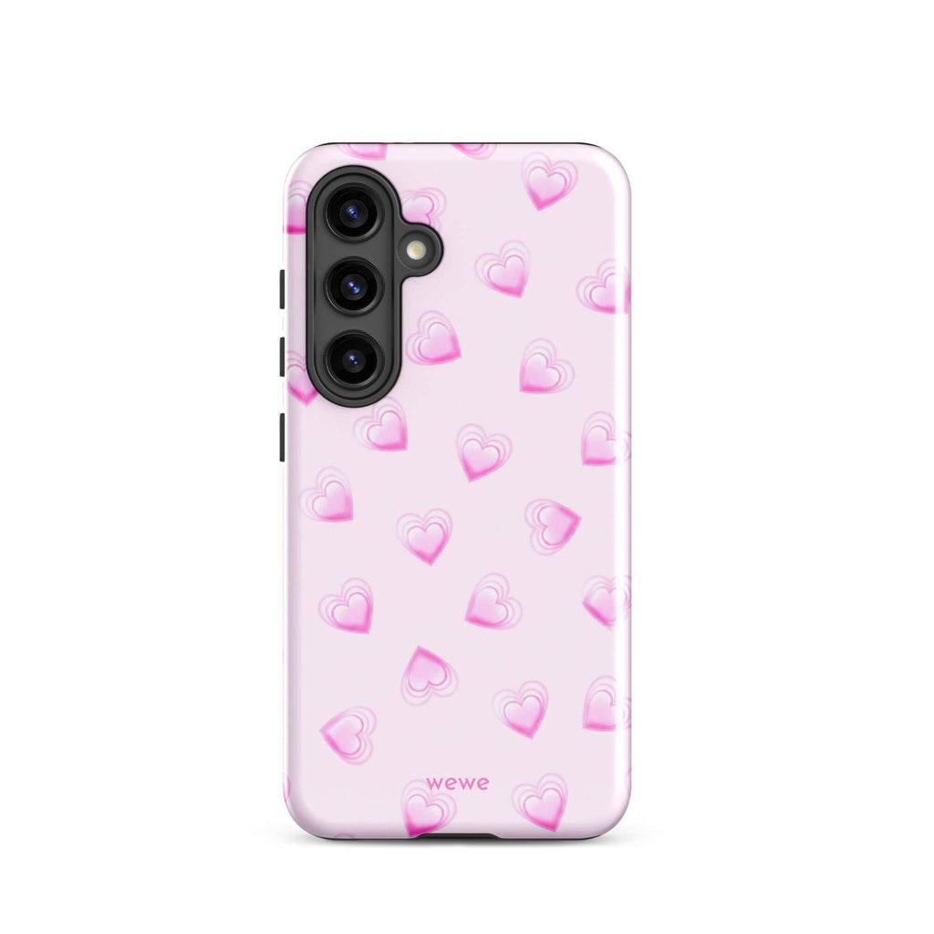 Pink Mini Heart Phone Case featuring scattered small gradient-pink hearts and layered outlines on a pale blush background