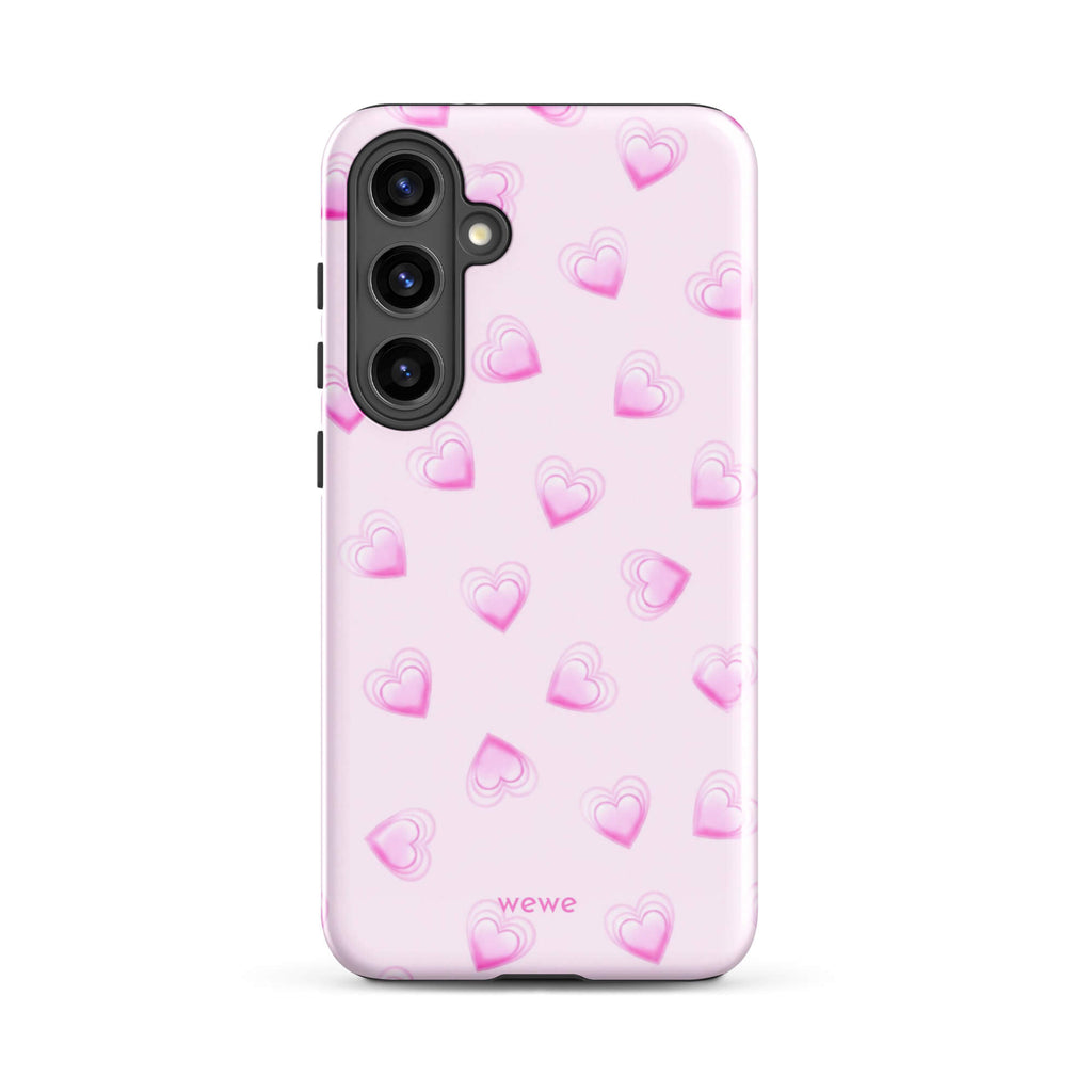 Pink Mini Heart Phone Case featuring scattered small gradient-pink hearts and layered outlines on a pale blush background