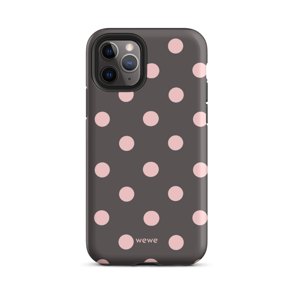 Custom iPhone 11 pro tough case in matte dark grey/charcoal with large light pink (blush) polka dots and 'wewe' branding at the bottom.