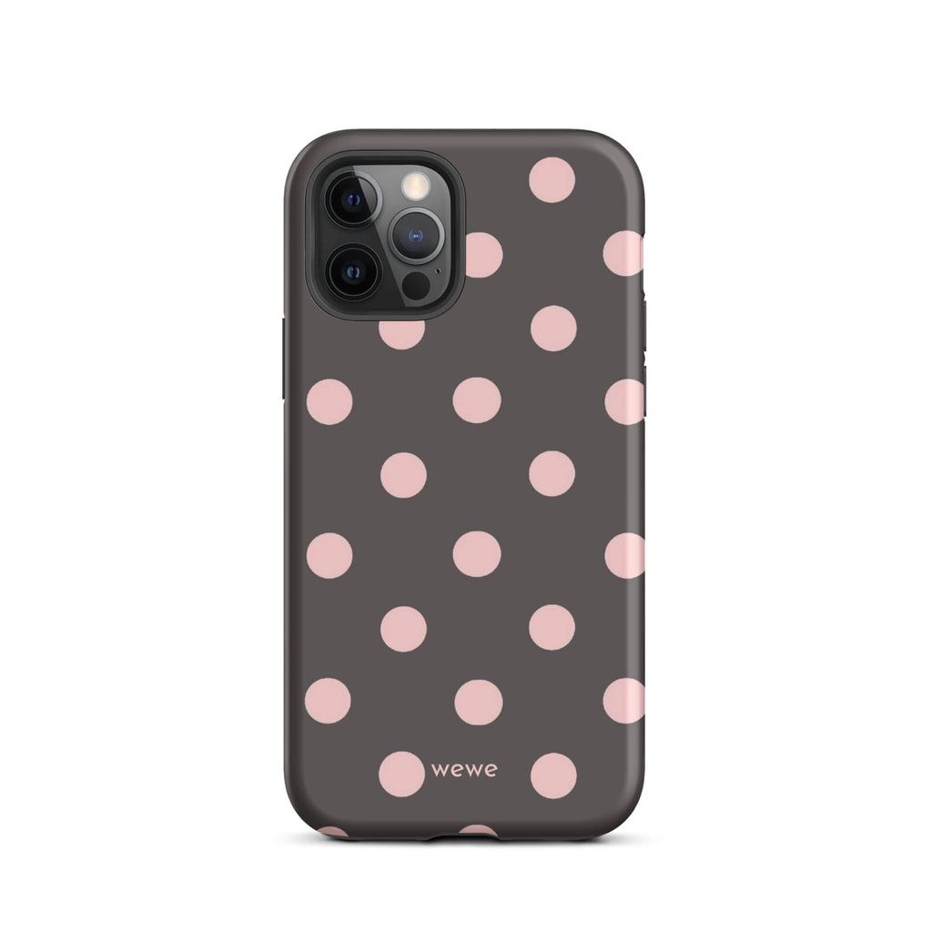 Custom iPhone 12 pro tough case in matte dark grey/charcoal with large light pink (blush) polka dots and 'wewe' branding at the bottom.