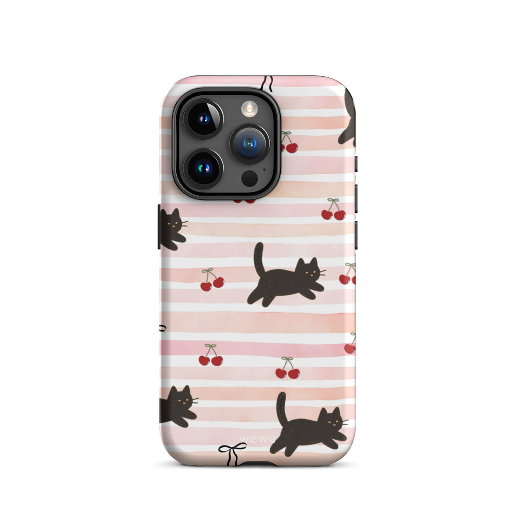 Custom iPhone case 15 pro with a cute pattern of black cats, cherries, and ribbon bows on a pink and white striped background.