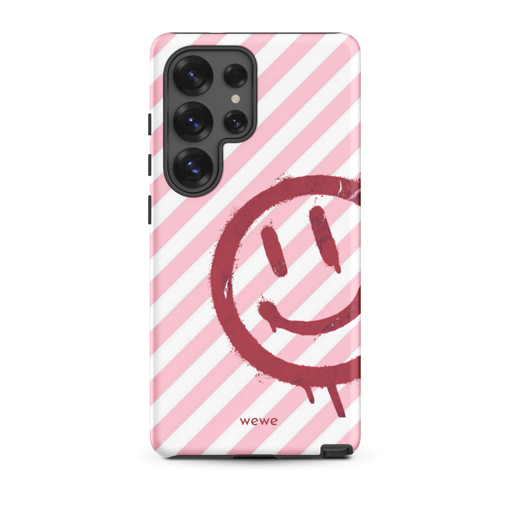 Custom samsung galaxy s25 ultra  Phone case with a pink and white diagonal stripe background and a red spray paint graffiti smiley face.
