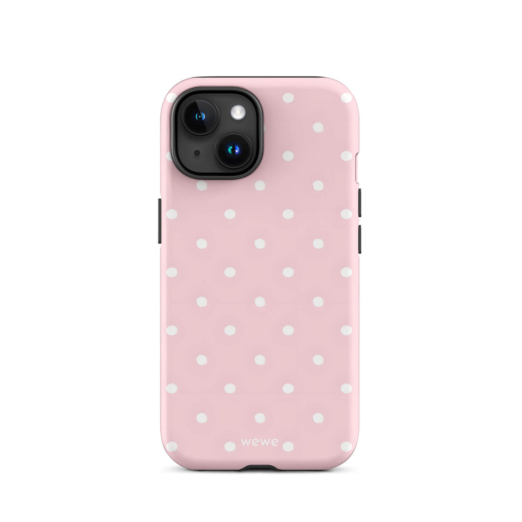 Custom iPhone case 15 with a soft pink background and a pattern of small white polka dots.