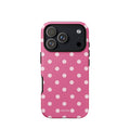 Raspberry-pink iPhone case with evenly spaced blush-pink polka dots