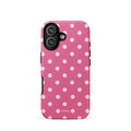 Raspberry-pink iPhone case with evenly spaced blush-pink polka dots