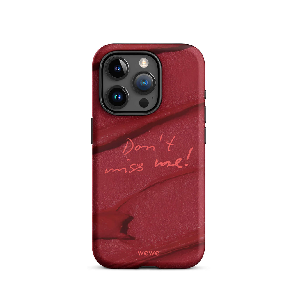 Custom iPhone case 15 pro with a deep red, textured lipstick smudge design and the handwritten text "Don't miss me!".