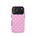 Candy-pink iPhone case with evenly spaced soft-white polka dots